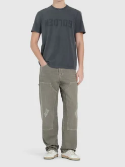 T-shirt in jersey di cotone distressed con logo